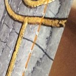 Orange thread binding, detail