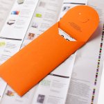 Monsterkamer, orange envelope on top of a sheet